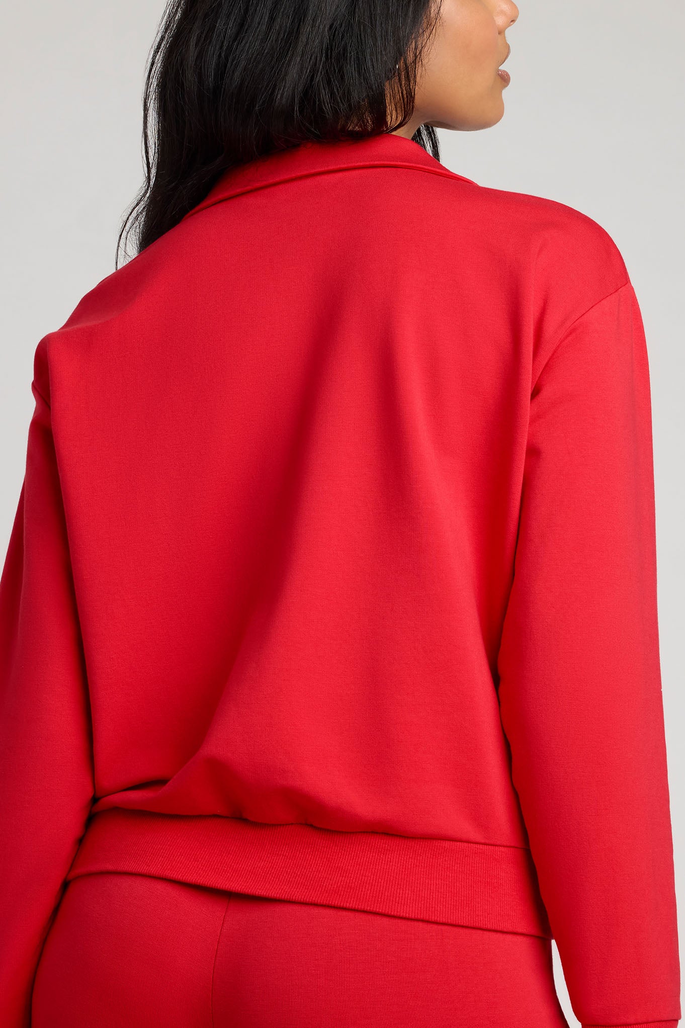Cherry red long-sleeve pullover with collared back and smooth seams