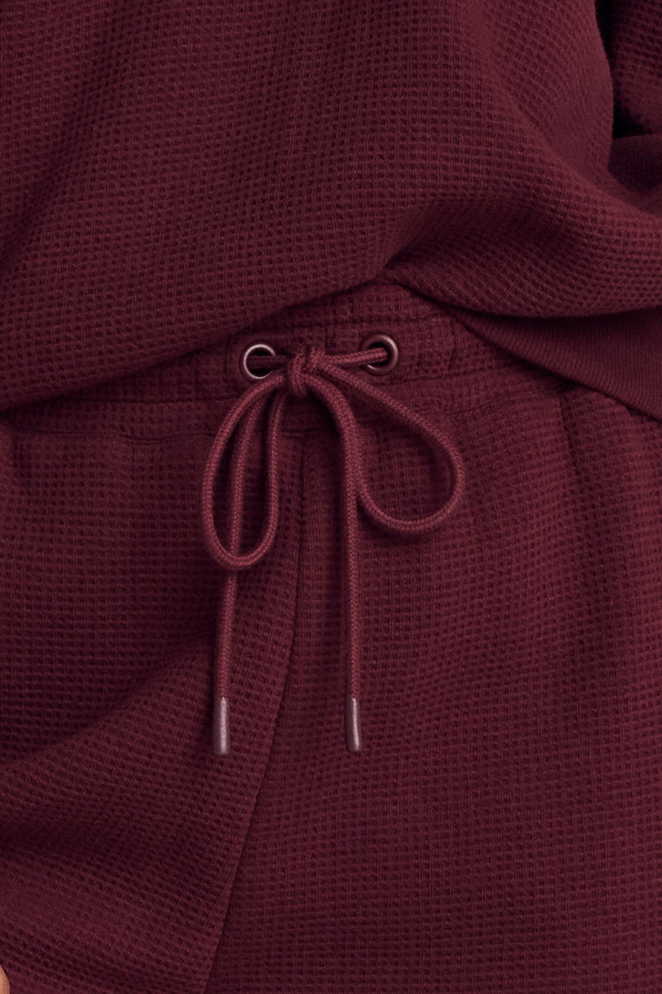 Garnet waffle knit cropped track pant, detail view of cropped hem and drawstring