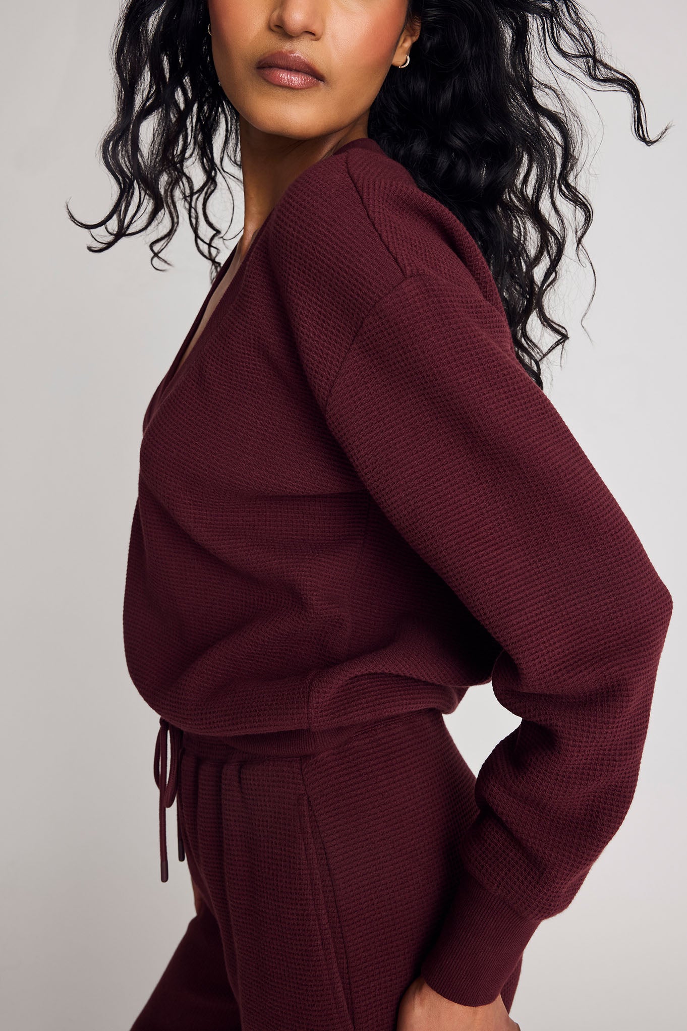 Garnet waffle knit deep-v sweatshirt, side view