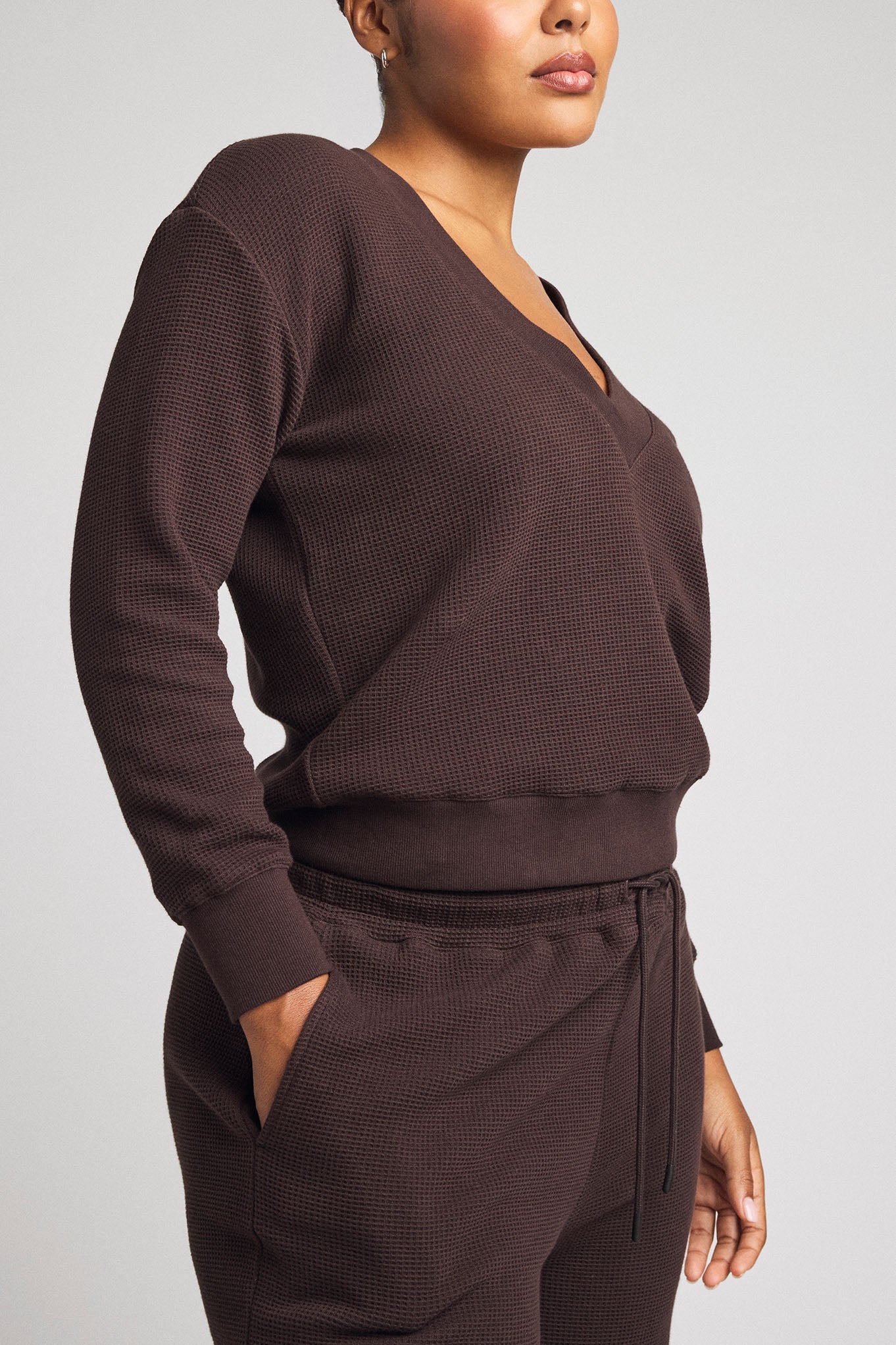 Dark brown waffle-knit deep V long-sleeve top with drawstring jogger pants