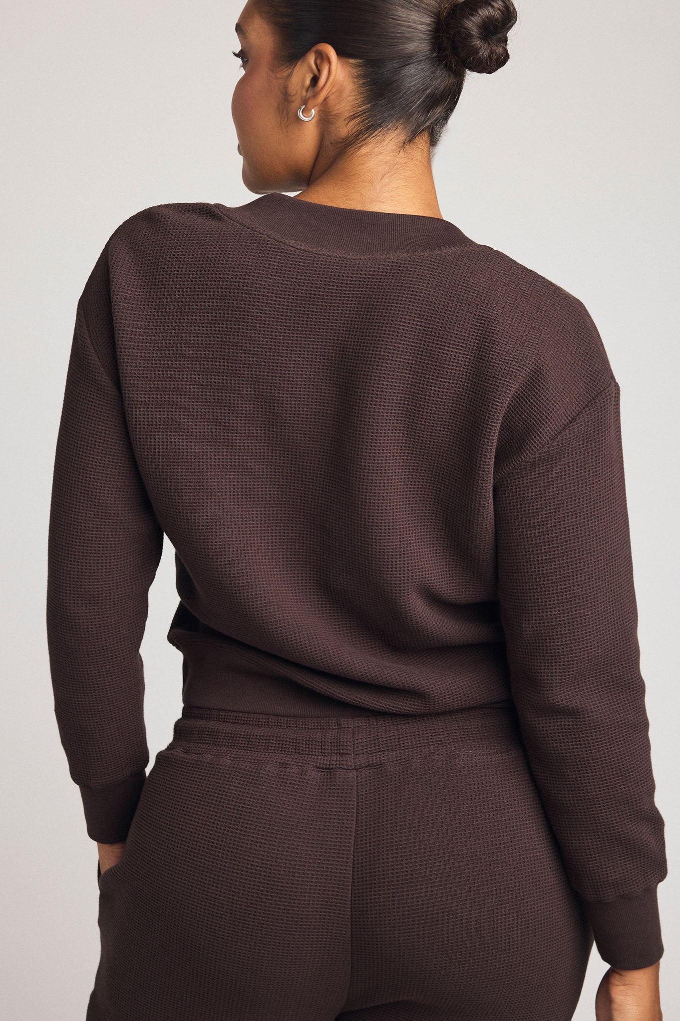 Dark brown waffle-knit long-sleeve top and matching jogger pants, back view