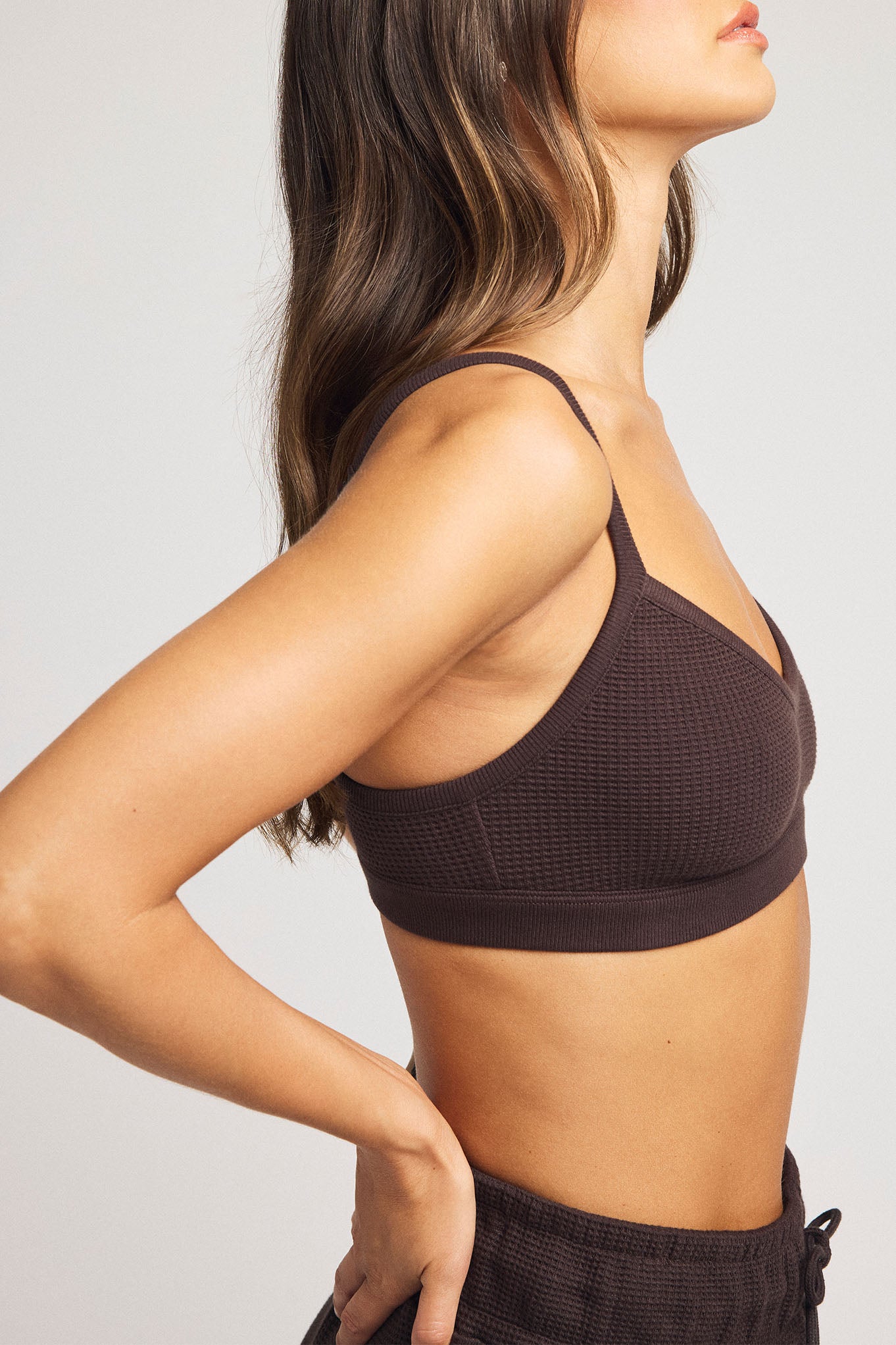 Dark brown waffle-knit bralette with racerback straps and elastic bottom band